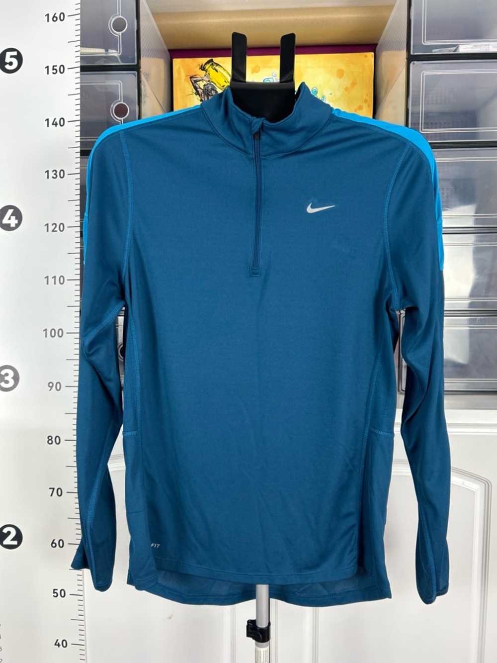 Nike women’s Teal and Turquoise Quarter-Zip Performance Top